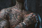 tattto man wearing disel bracelet