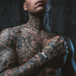 tattto man wearing disel bracelet