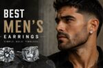 Best men’s earrings featuring silver round-cut stud earrings styled on a male model in a modern masculine jewelry editorial.