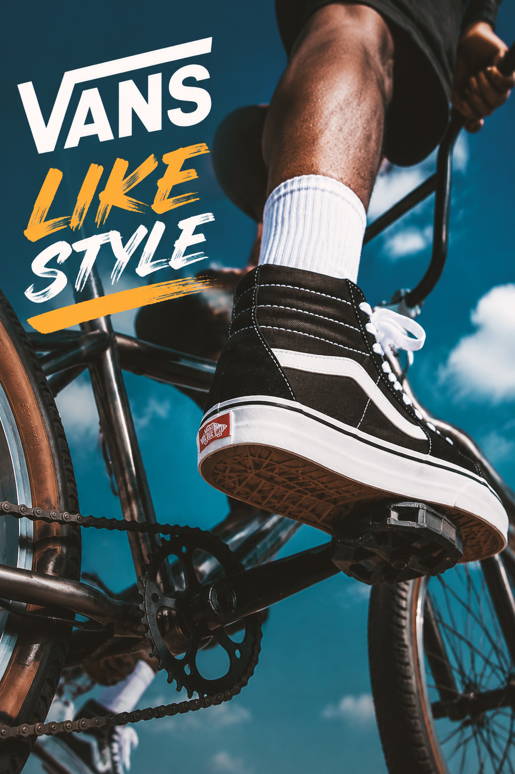 man wearing vans on a bike